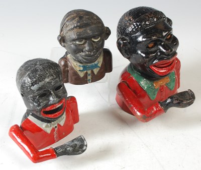 Lot 274 - A group of three cast metal figural Jolly 'Boy'...