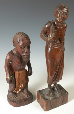 Lot 243 - A 20th century hand carved wooden statue...