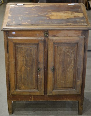 Lot 553 - A 20th century French pine slant front desk,...
