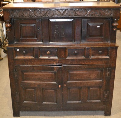 Lot 568 - An antique oak court cupboard, the top section...