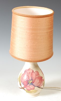 Lot 349 - A Moorcroft Magnolia pattern table lamp, of...