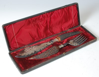 Lot 291 - An antique two piece carving set with antler...