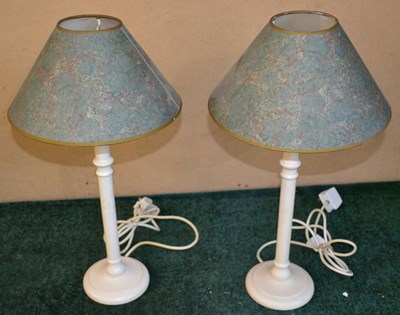 Lot 494 - A pair of white painted wooden table lamps,...
