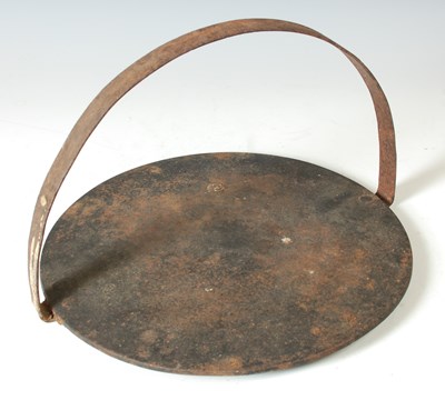 Lot 315 - A 19th century cast iron gypsy griddle plate,...