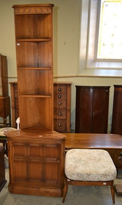 Lot 529 - A mid-century Ercol corner cupboard, with four...