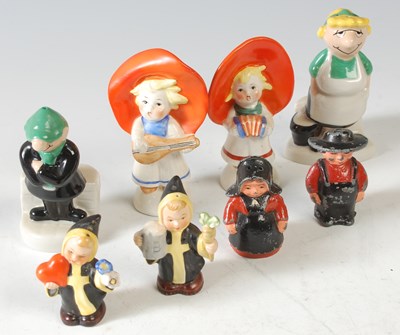 Lot 280 - A group of salt and pepper shakers, to include...