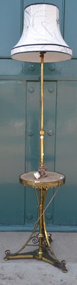 Lot 547 - An early 20th century brass floor lamp,...
