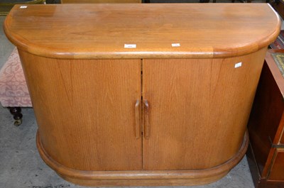 Lot 555 - A mid-century teak cabinet, with tambour doors,...