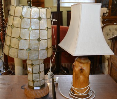 Lot 567 - A rustic table lamp, the polished wooden base...