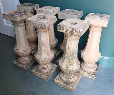 Lot 568A - A group of seven terracotta balusters, with...