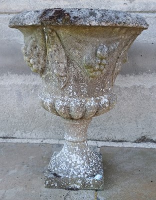 Lot 568C - A composite stone urn garden planter, in...