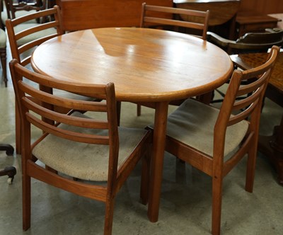 Lot 575 - A mid-century teak dining table set, the...