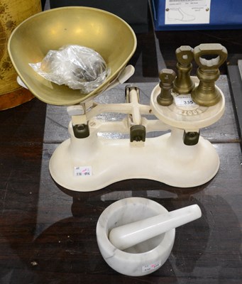 Lot 335 - A 20th century cast white metal balance scale,...