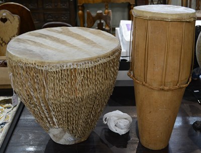 Lot 337 - A 20th century African Tribal drum, with an...