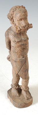 Lot 246 - A 20th century hand carved wooden figure...