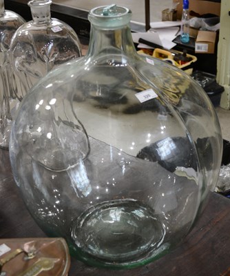 Lot 320 - A large clear glass carboy jar with stopper,...
