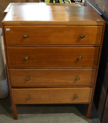 Lot 580 - A mid-century oak four drawer chest, the...
