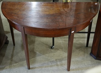 Lot 584 - A Georgian mahogany demi lune console table,...