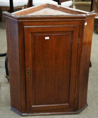 Lot 587 - A 19th century oak corner cabinet of...