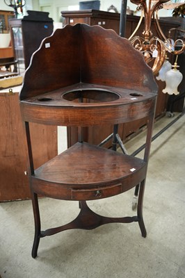 Lot 591 - A 19th century mahogany two tier corner wash...