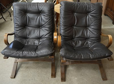 Lot 610 - A pair of mid-century black leather button...