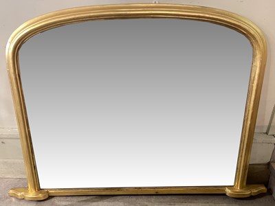 Lot 646 - A gilt over mantle mirror, with arched top and...