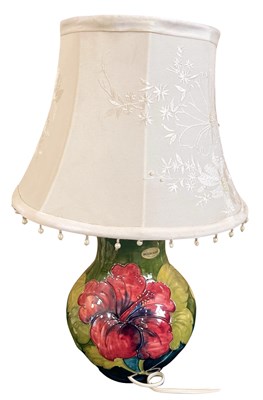 Lot 345 - A Moorcroft hibiscus pattern table lamp of...