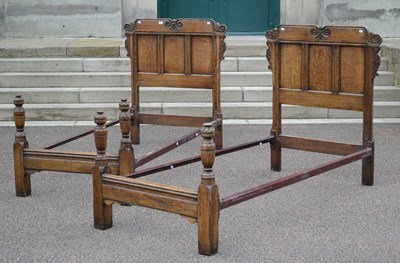 Lot 512 - A pair of early 20th century carved oak single...