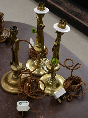 Lot 343 - A group of three brass gimbal lamps rewired in...