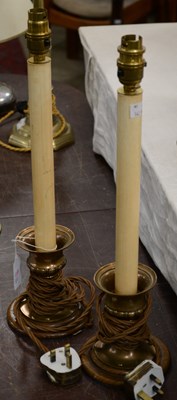 Lot 344 - A pair of 20th century brass candlestick lamps...