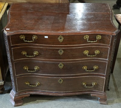 Lot 583 - A Chippendale mahogany style serpentine chest...