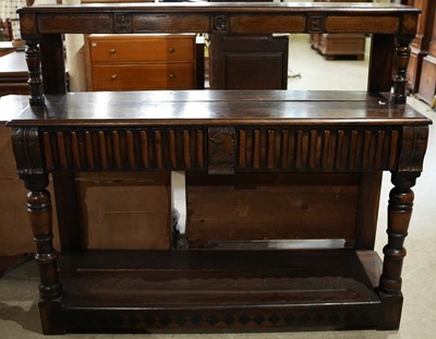 Lot 597 - An antique oak two tiered console table, the...