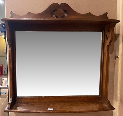 Lot 655 - An early 20th century oak wall mirror in the...