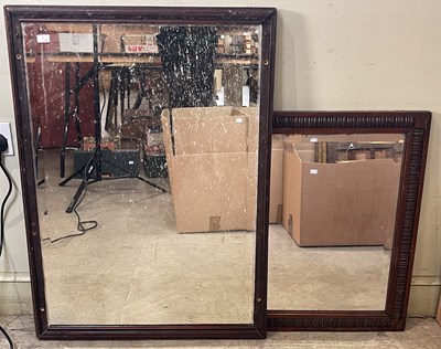 Lot 656 - An early 20th century oak wall mirror, with...