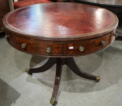 Lot 602 - A 19th century mahogany drum table, with red...