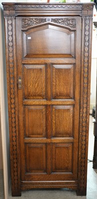 Lot 619 - An early 20th century Arts & Crafts style oak...