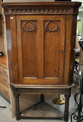 Lot 624 - A 19th century oak corner cupboard in the...