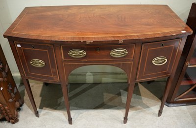 Lot 637 - A Georgian mahogany bow front sideboard, with...