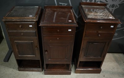 Lot 632 - A group of three mahogany bedside drawers,...