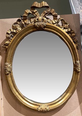 Lot 662 - A 19th century / later giltwood oval mirror,...