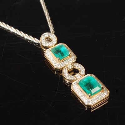 Lot 2A - A 9ct white gold emerald and diamond pendant...