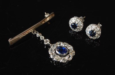 Lot 34 - A white metal sapphire and diamond pendant...
