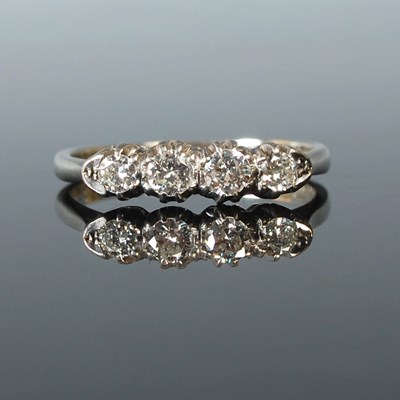 Lot 55 - An 18ct white gold and diamond four stone...