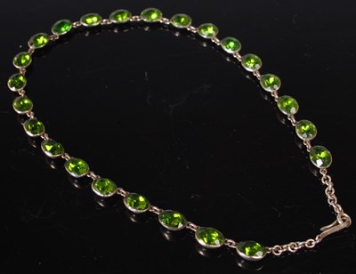 Lot 15 - A white metal and peridot set necklace, 43cm...