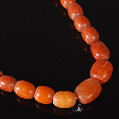 Lot 15C - A graduated butterscotch amber bead necklace,...