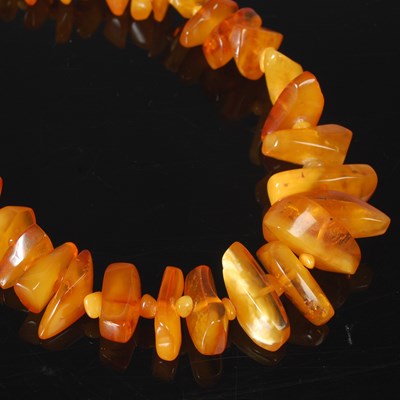 Lot 15D - A Baltic amber bead necklace, formed from...