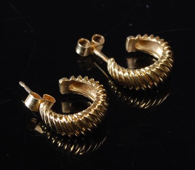 Lot 16 - A pair of 18ct gold earrings, C shaped of...