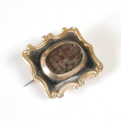 Lot 26 - A late 19th century yellow metal and black...