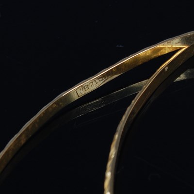 Lot 36 - Five gold bangles, each testing as 18ct gold,...