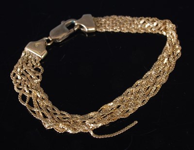 Lot 50 - An 18ct gold multi strand bracelet, stamped...
